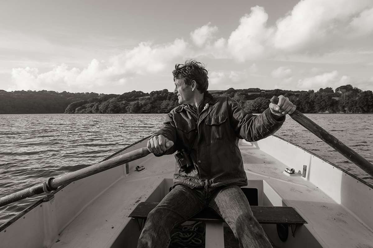 photo of a man rowing